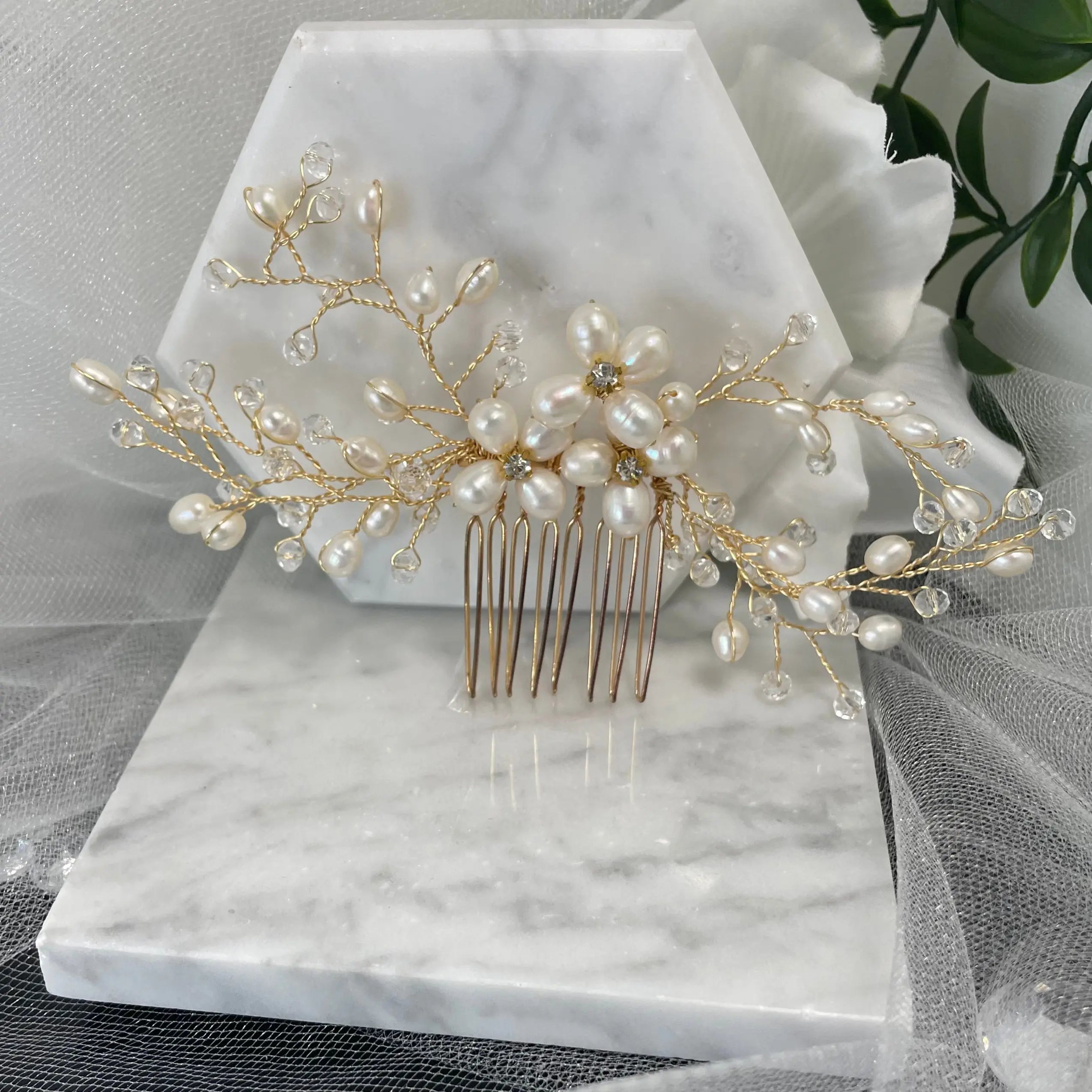 Adalynn Pearl and Crystal Wedding Comb featuring three flowers with diamanté centers and gold wiring, perfect for adding luxurious elegance to bridal hairstyles.