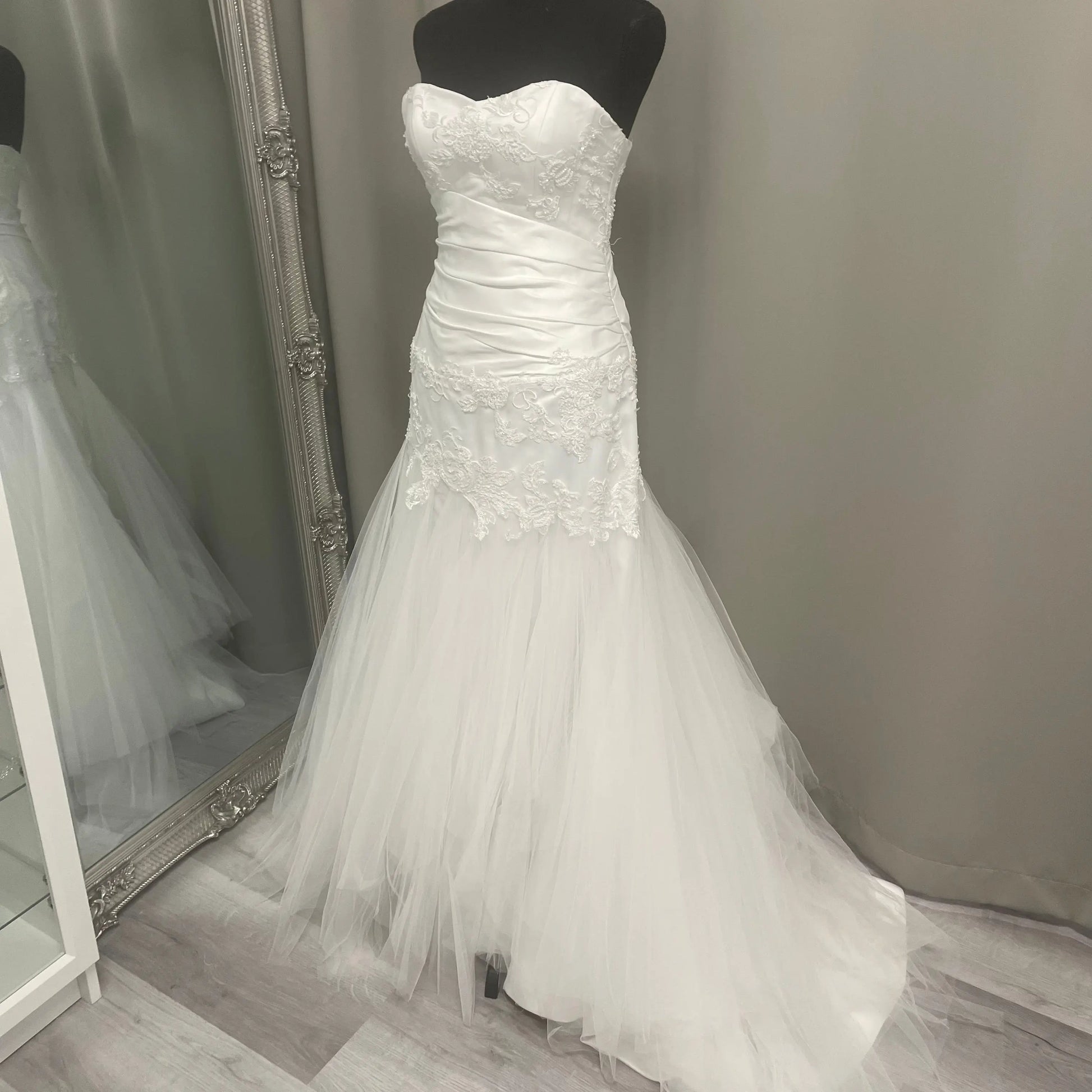 Amber Lace Wedding Dress featuring a mermaid silhouette with lace and crepe materials, sweetheart neckline, low V-back design, and a long trailing train, perfect for modern and elegant brides.