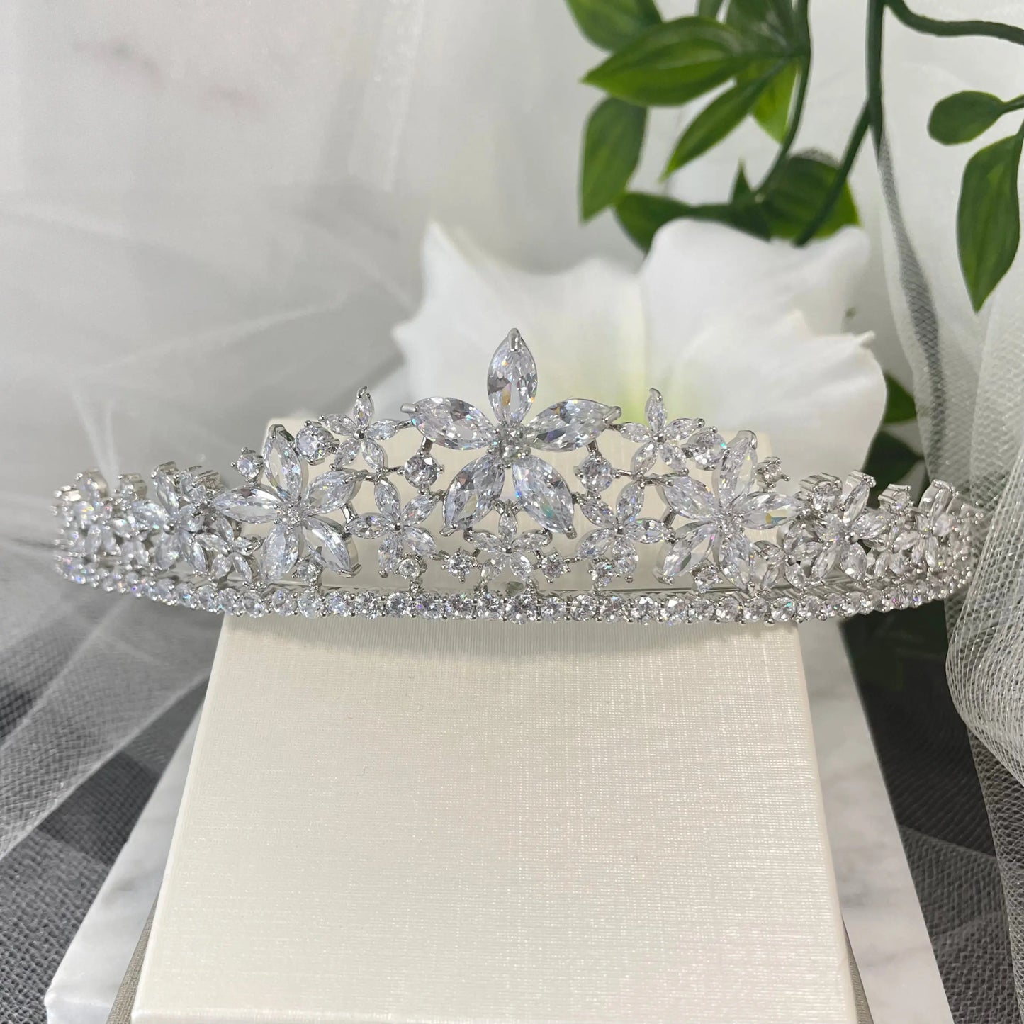 Brianna Bridal Tiara, featuring a stunning floral design with sparkling zirconia crystals, perfect for adding elegance and brilliance to any bridal outfit.