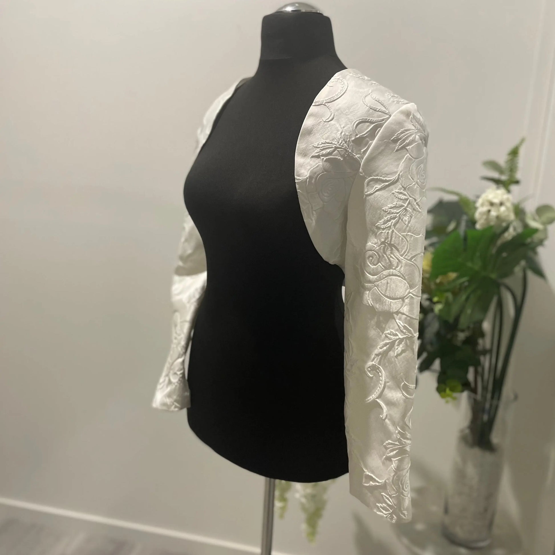 Front view of Charoite silk bolero jacket with 3D texture print, ideal for brides looking for a luxurious wedding day accessory.