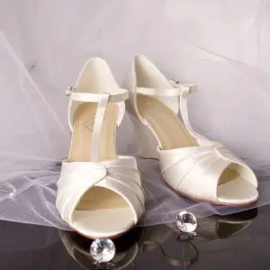 Darcy Wedge Bridal Shoe Pair Front and Side View: Front and side view of two Darcy Wedge Wedding Bridal Shoes showcasing the T-bar ankle strap and open toe design.