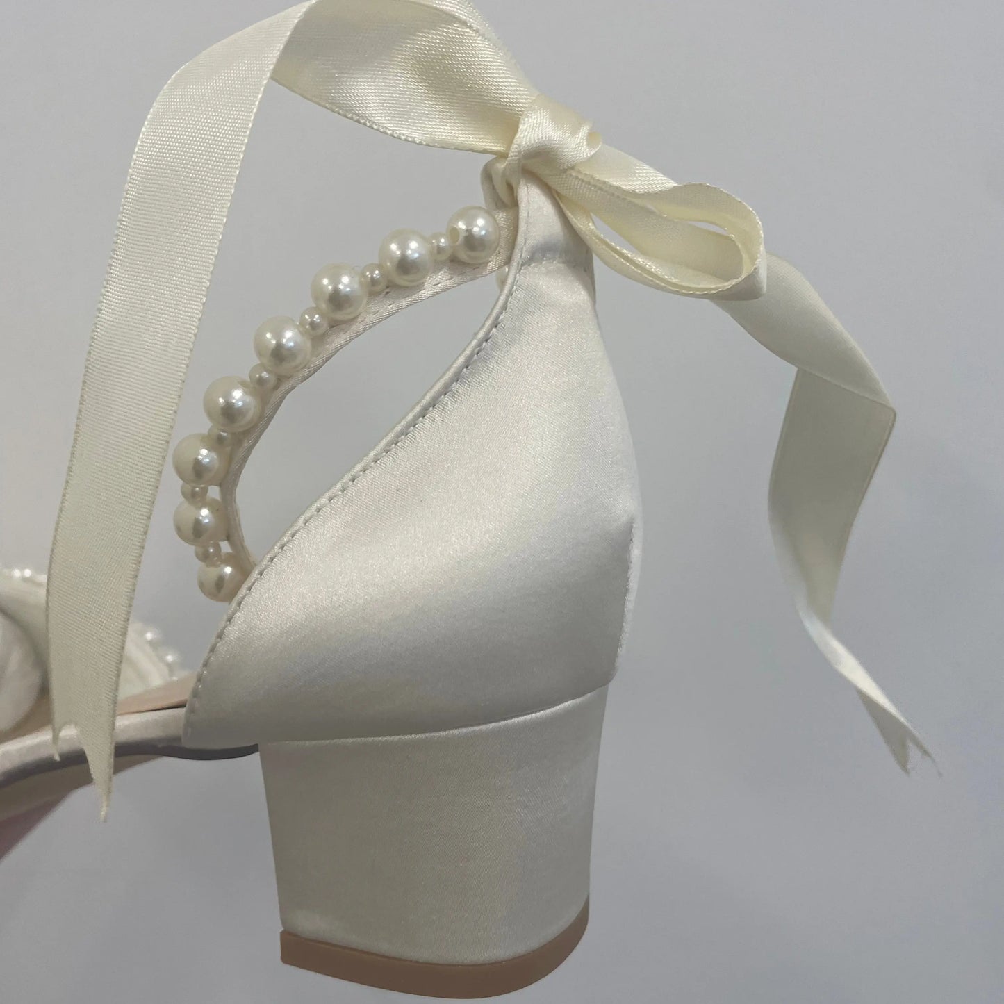 Dixie Bridal Shoe Different Heel View: View of the different heel showcasing the block heel design.