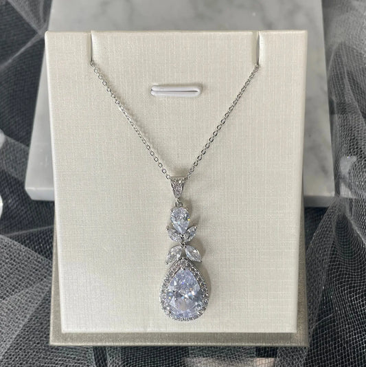 Ela Pendant Necklace (Silver): Elegant silver tear drop pendant necklace set with cubic zirconia, perfect for brides and special occasions.