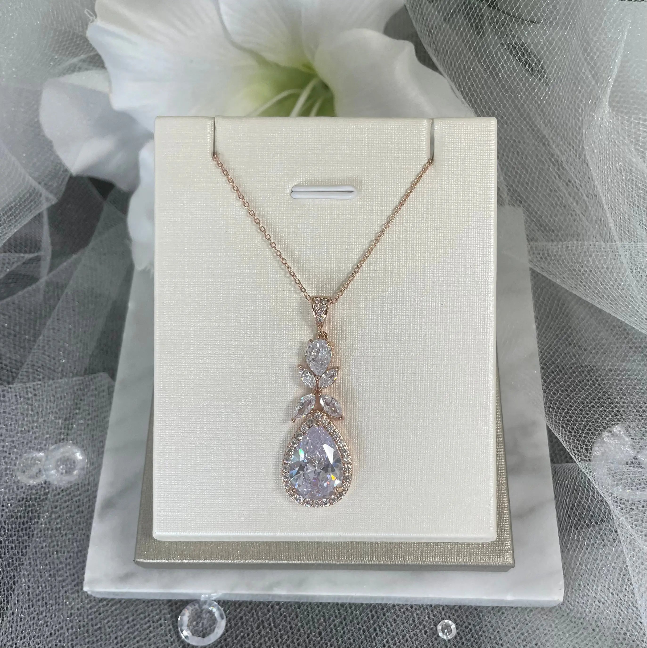 Ela Pendant Necklace (Rose Gold): Stunning rose gold tear drop pendant necklace set with cubic zirconia, perfect for brides and special occasions.