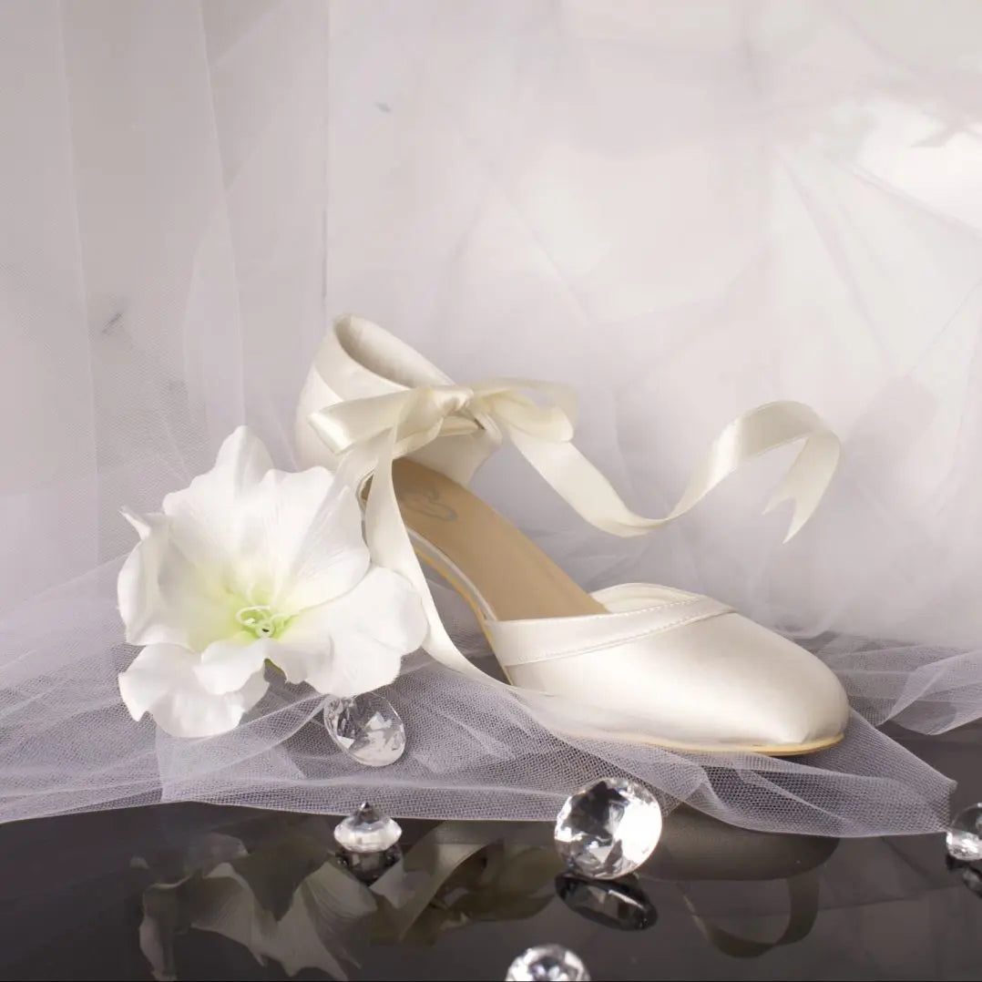 Ellie Bridal Shoe Single Side View: Side view of one Ellie Closed Toe Ribbon Ankle Strap Wedding Bridal Shoe highlighting the elegant rounded toe and satin detail.