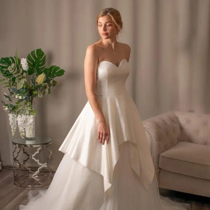 Everlee satin tulle ballgown wedding dress with sweetheart neckline and scalloped overskirt.