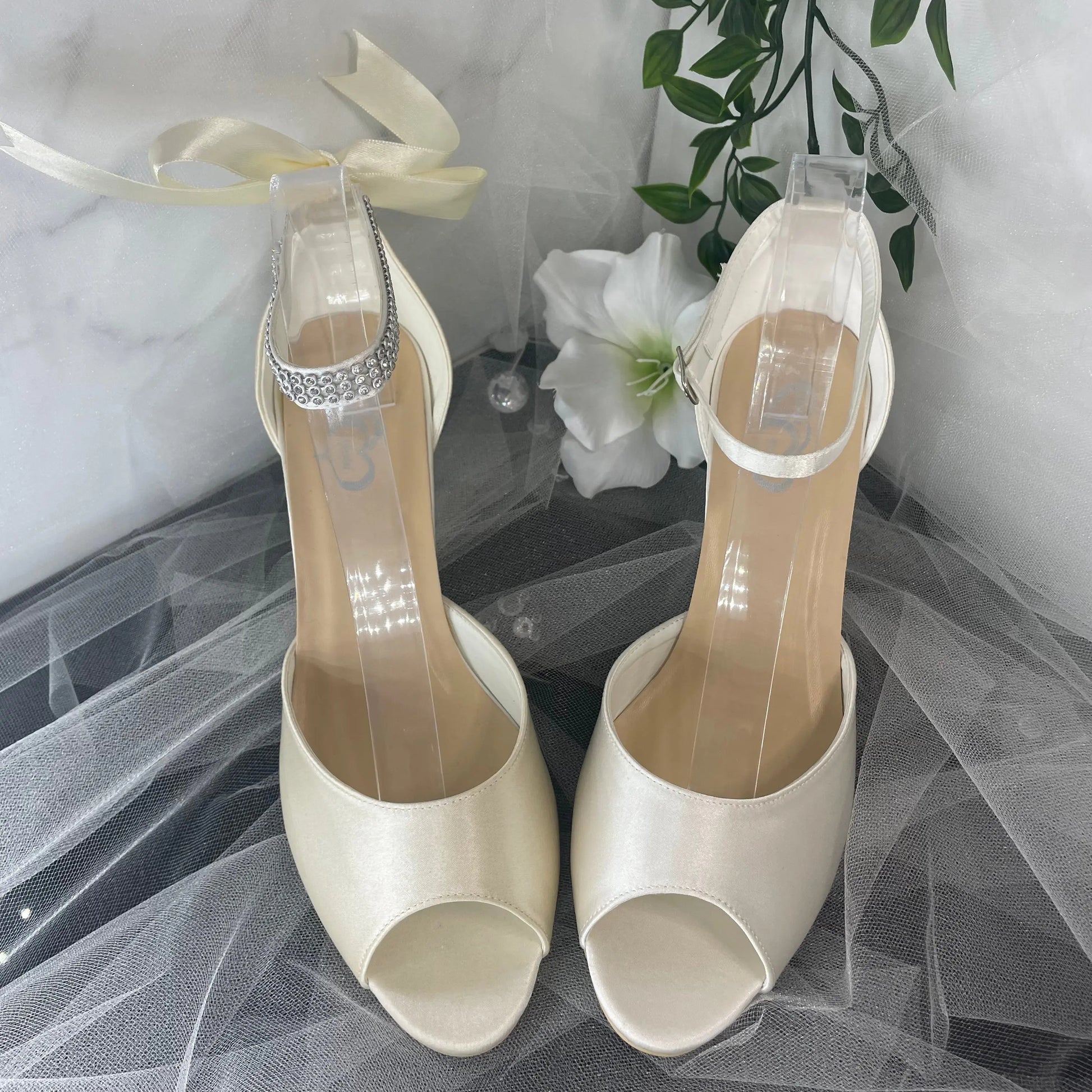 Faith Bridal Shoe Pair Front View Different Color: Front view of two Faith Peep Toe Diamanté Ankle Strap Wedding Bridal Shoes displaying the graceful design and slight color variation.