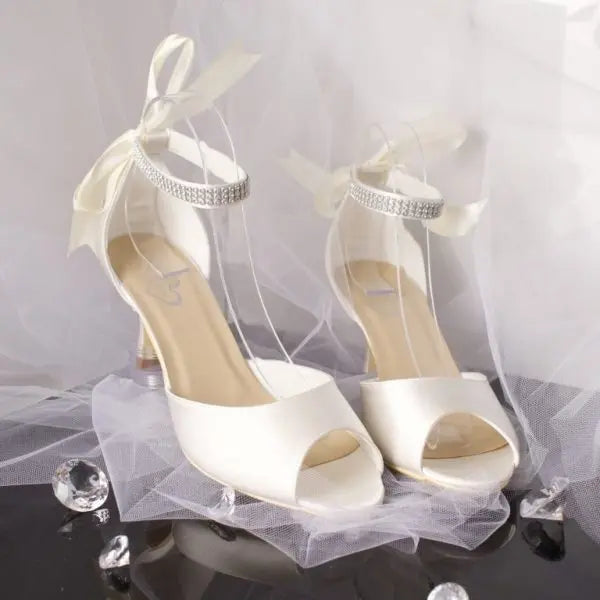 Faith Bridal Shoe Pair Side and Front View: Side and front view of two Faith Peep Toe Diamanté Ankle Strap Wedding Bridal Shoes showcasing the peep toe design and ankle strap options.