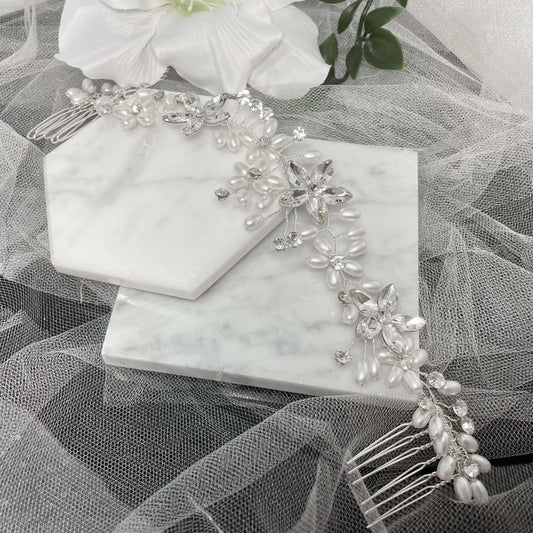 Floria Pearl and Diamanté Hair Comb featuring a floral design adorned with pearls and diamanté, measuring approximately 22.5 cm by 4.2 cm, perfect for weddings and special occasions.