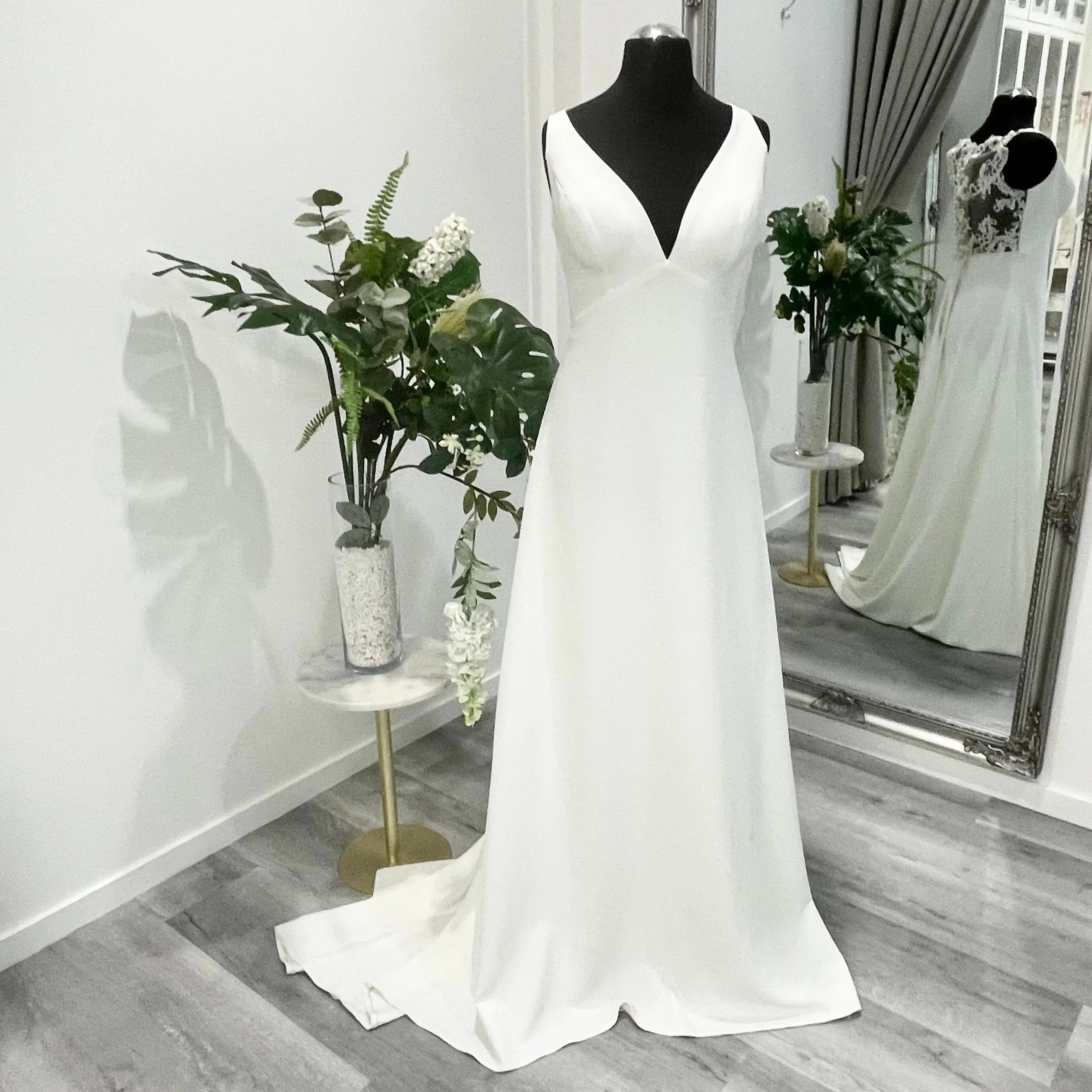 Isolde Wedding Dress - A minimalist design with elegant silhouette on display at Divine Bridal.