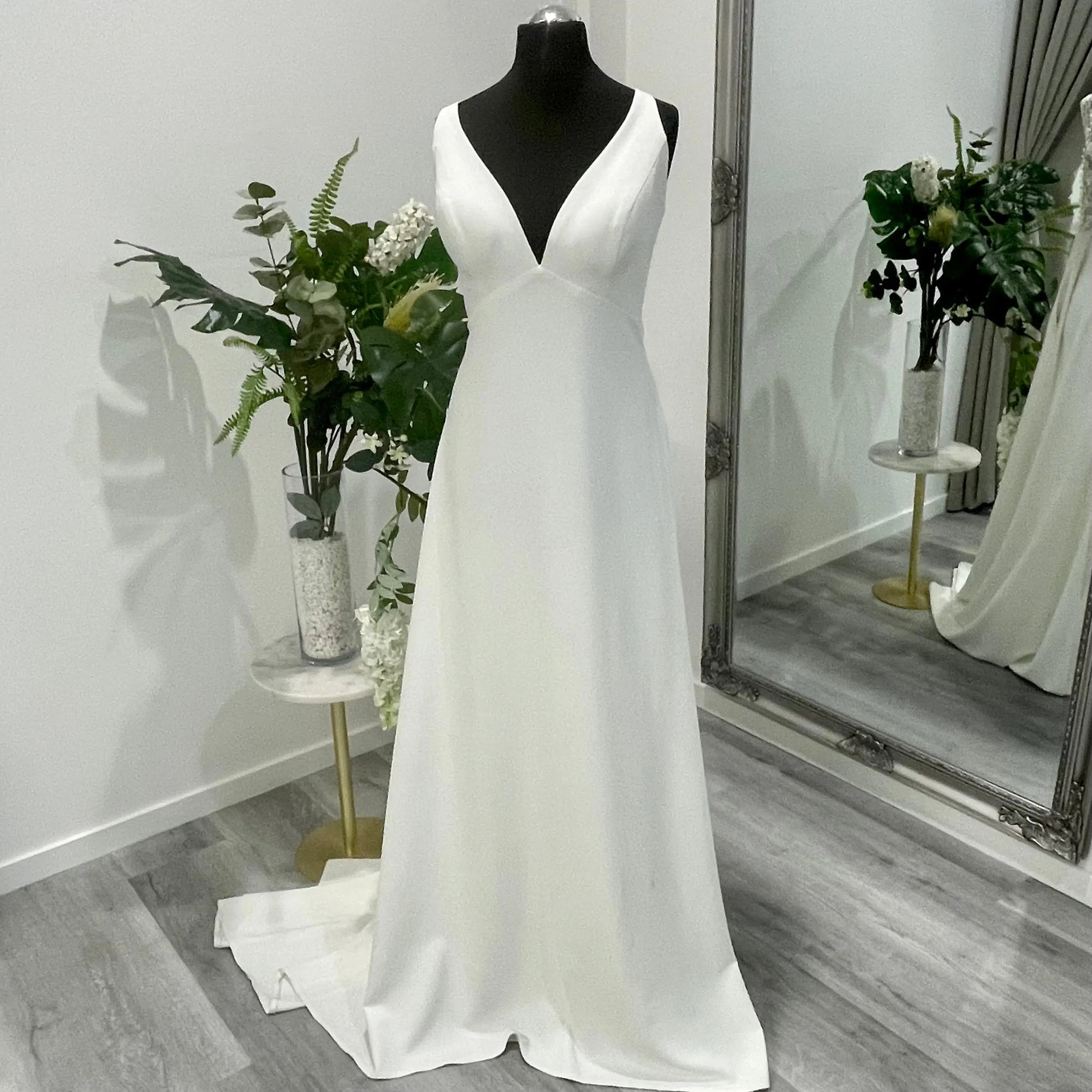 Isolde Wedding Dress - A minimalist design with elegant silhouette on display at Divine Bridal.