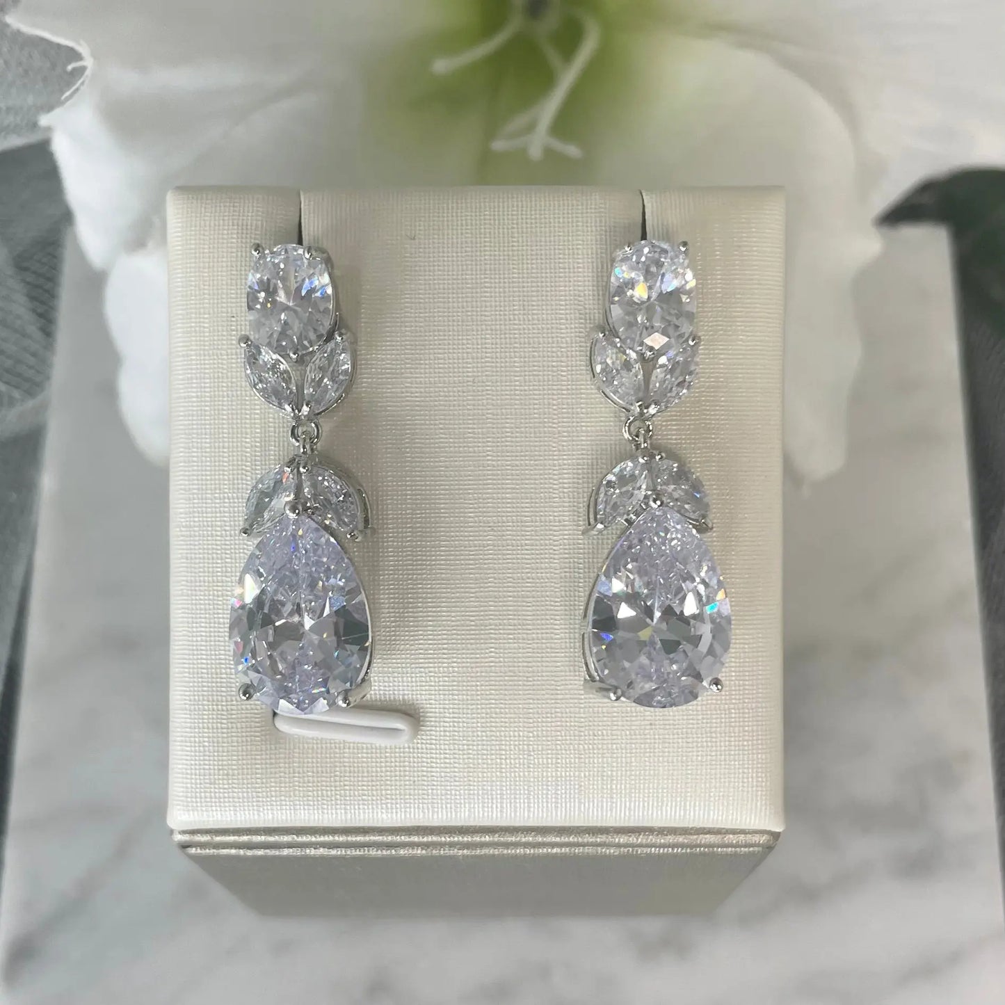 Image of Gigi crystal earrings showcasing their exquisite design and sparkling crystals.