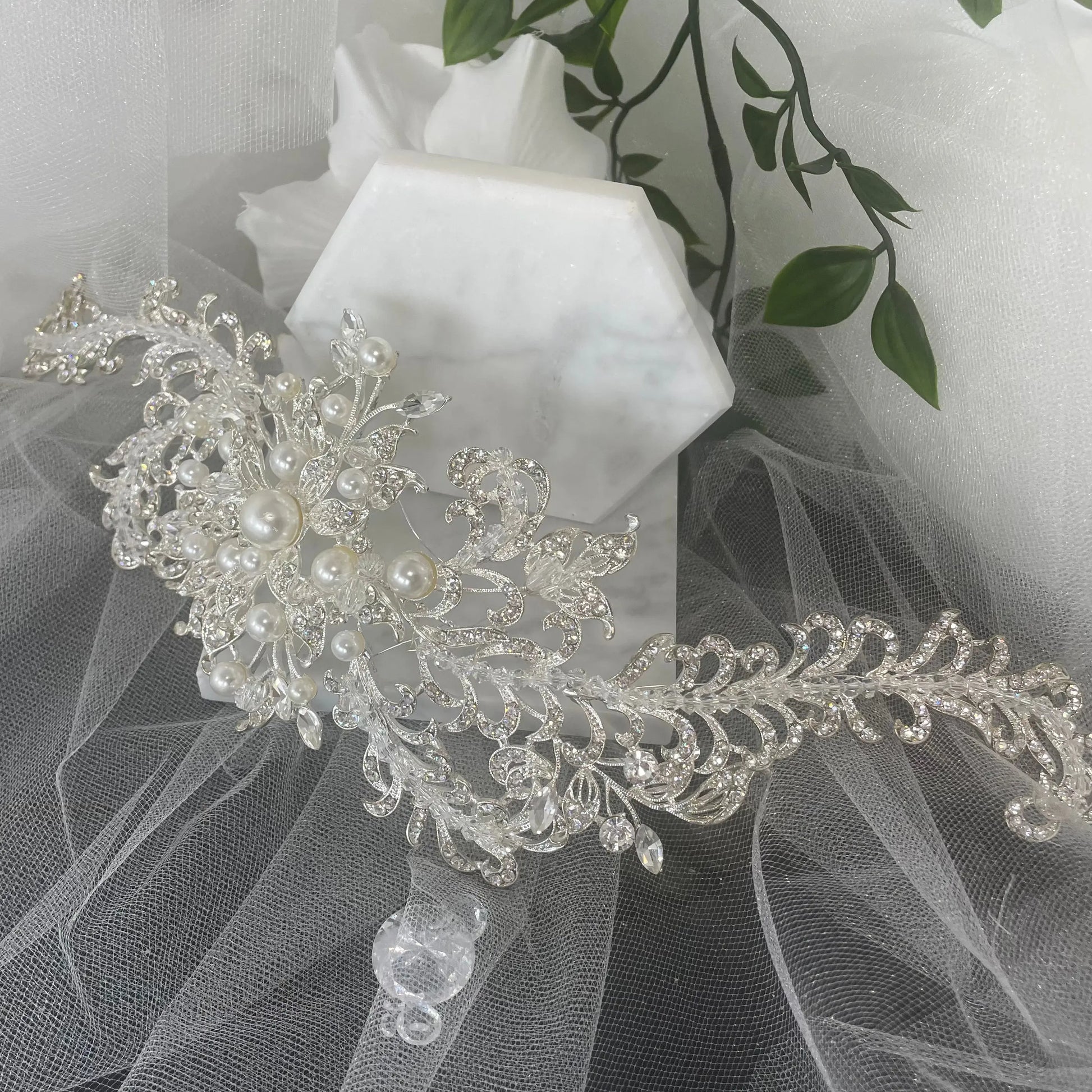 Elegant Harmony Bridal Headpiece in wave design, adorned with multi-size pearls, crystals, and Diamontes, available in silver and ivory, perfect for a statement wedding look.