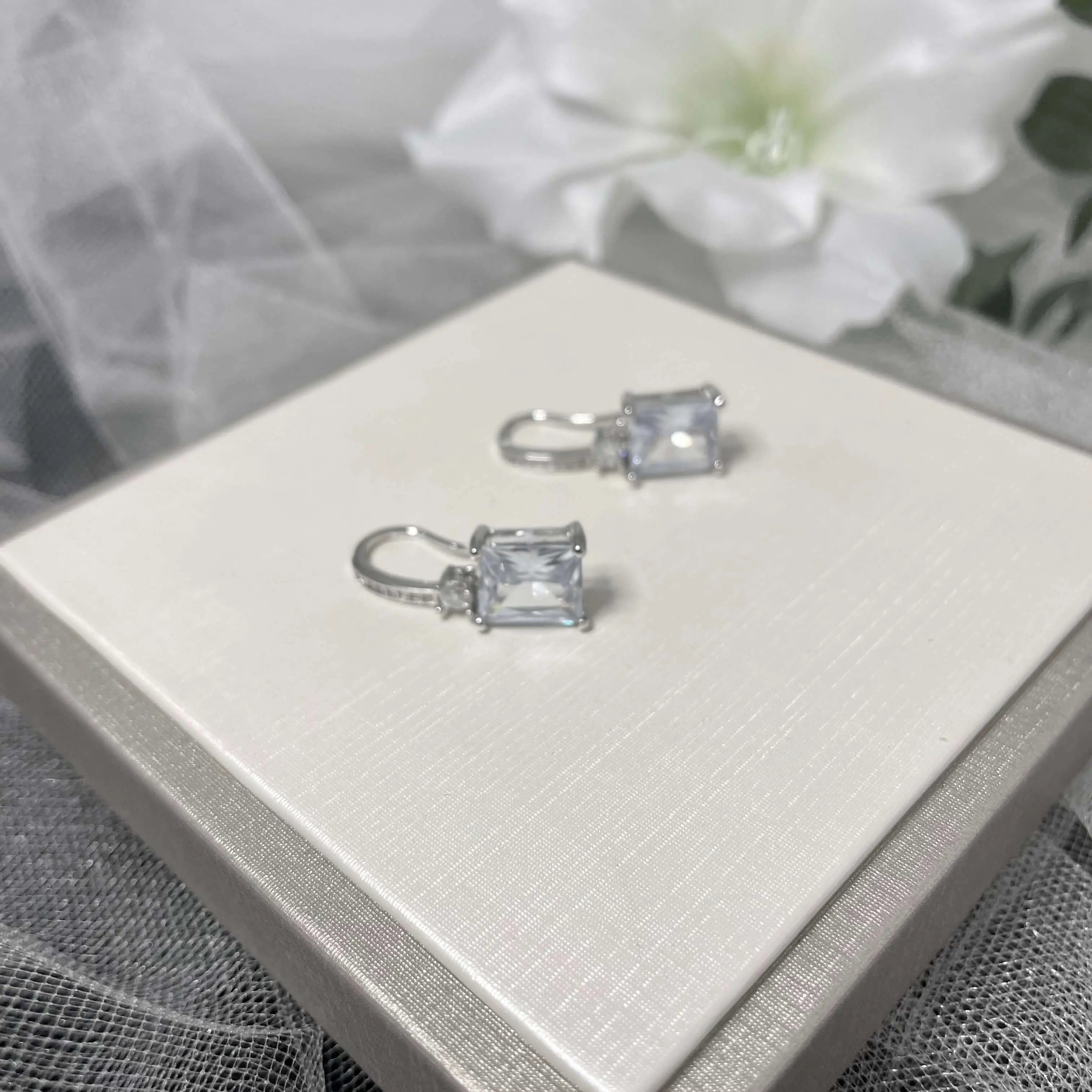 Henrietta Sterling Silver Cubic Zirconia Earrings featuring a princess drop design with AAAAA cubic zirconia stones set in 925 sterling silver, perfect for weddings and special occasions.