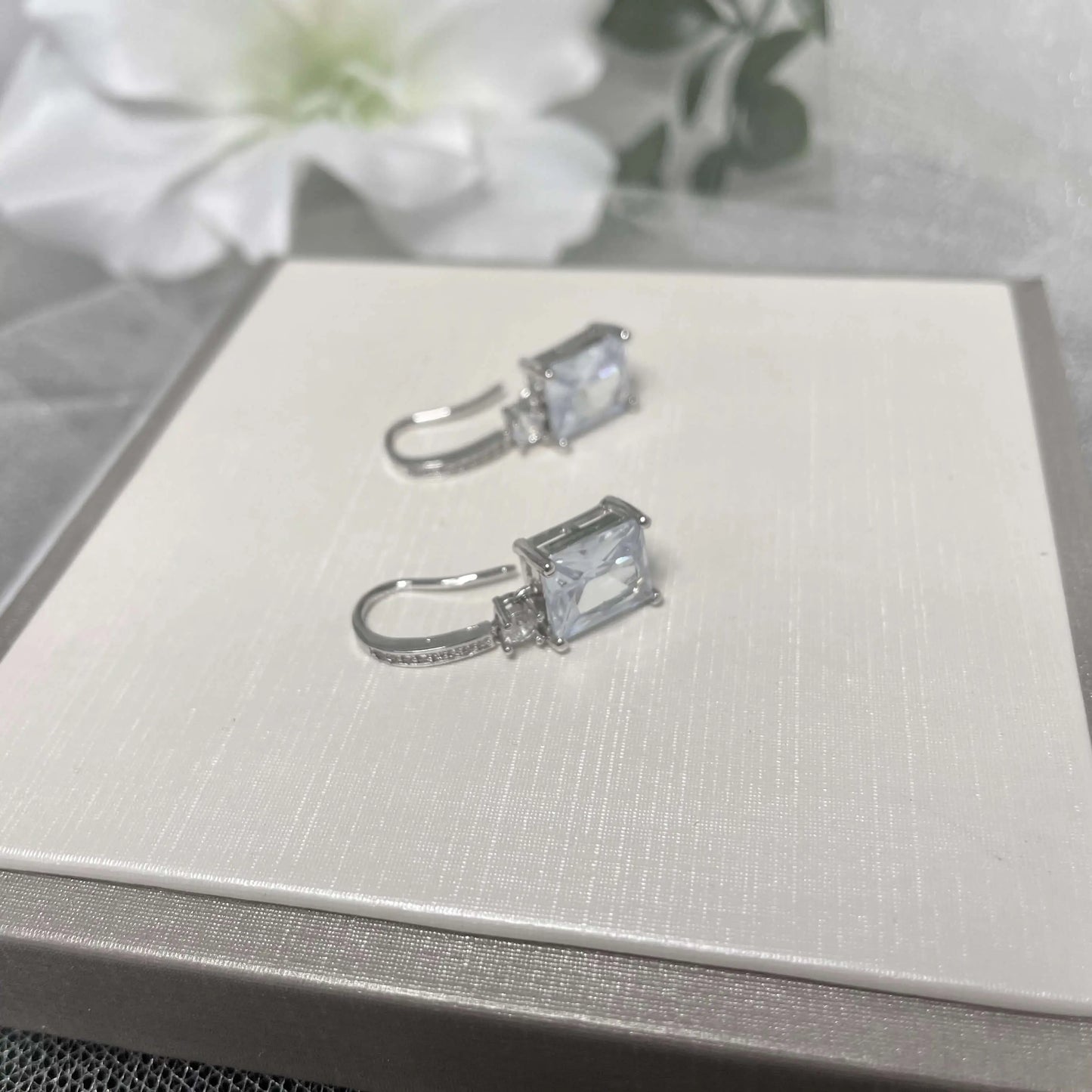 Henrietta Sterling Silver Cubic Zirconia Earrings featuring a princess drop design with AAAAA cubic zirconia stones set in 925 sterling silver, perfect for weddings and special occasions.