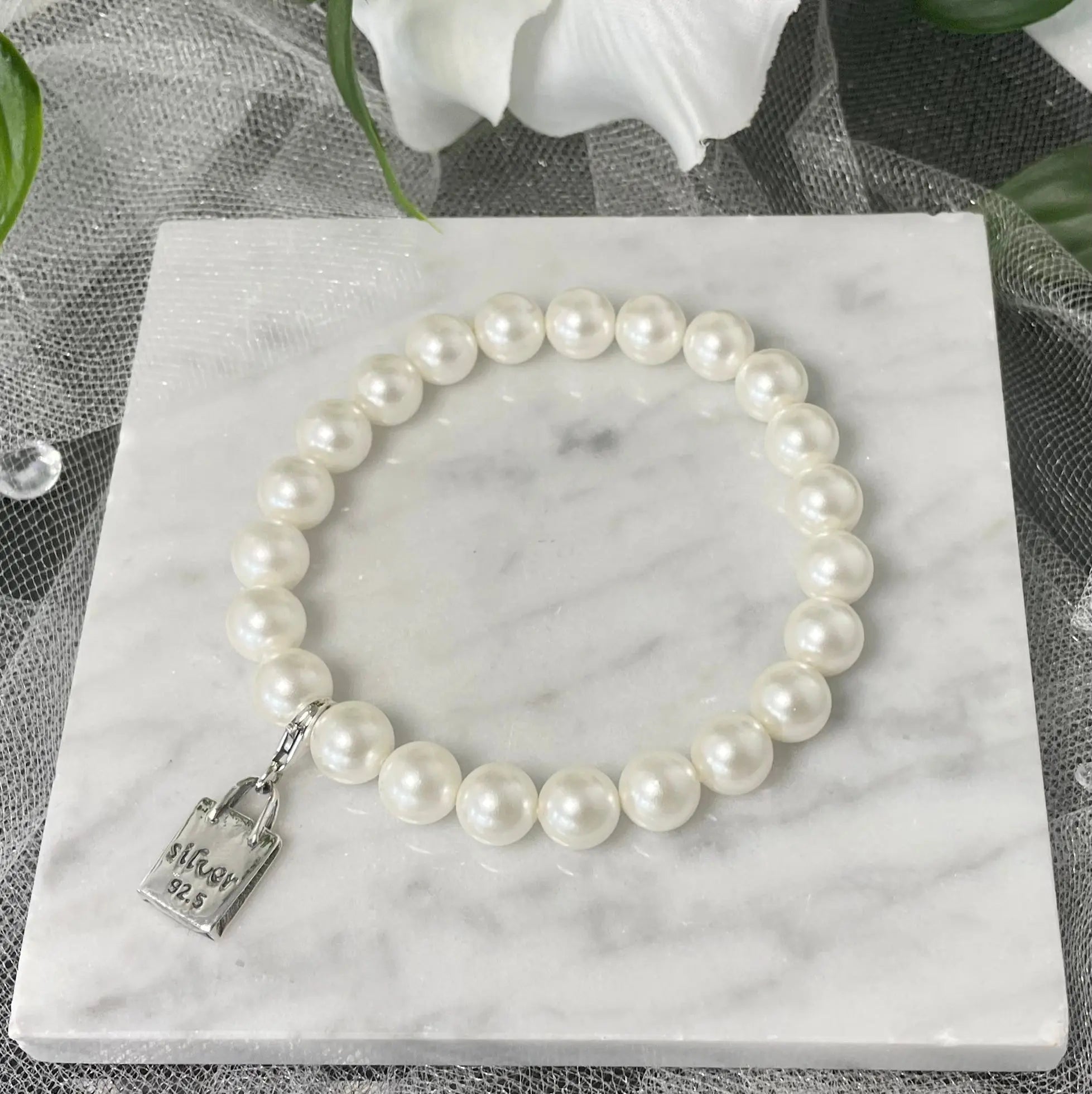 Elegant Isla Pearl Bracelet with 92.5% sterling silver design and elastic fit.