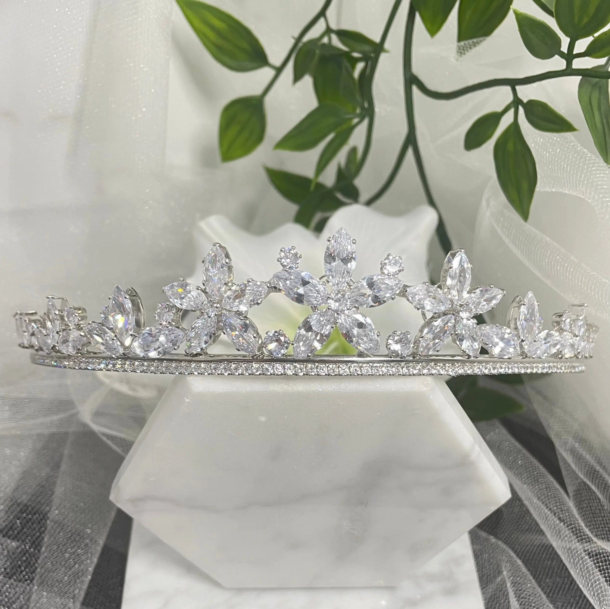 Katty Floral Crystal Headpiece Tiara, featuring elegant flower-like crystals and scattered CZs, perfect for adding a touch of regal elegance to any special occasion outfit.