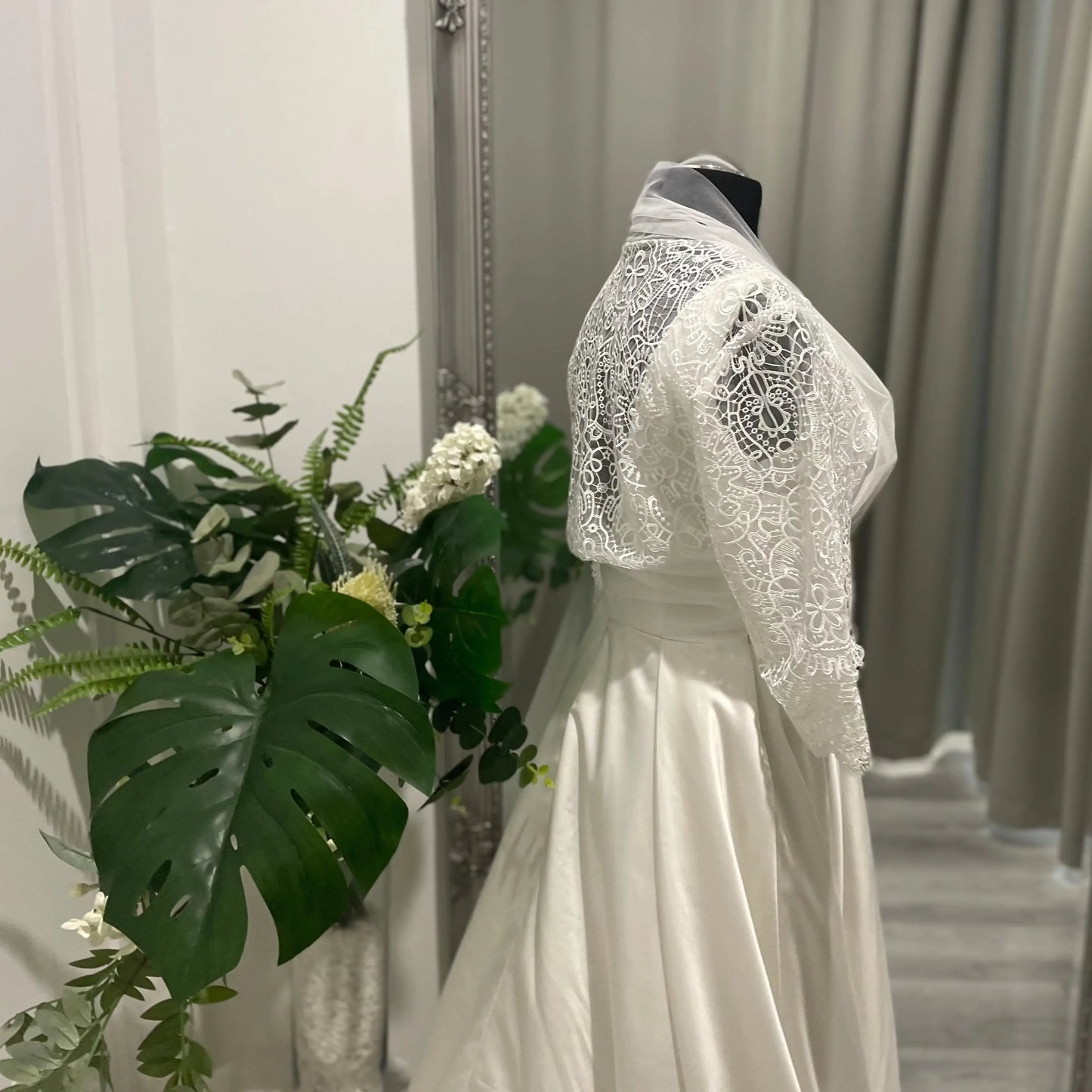 Back view of the Keira wedding bridal bolero jacket, highlighting elegant lace patterns and sheer detailing.