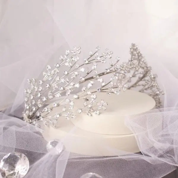 Stunning Larisa Bridal Headband, lavishly adorned with sparkling CZ crystals in a classic silver setting, designed to add radiant elegance to any bridal hairstyle.