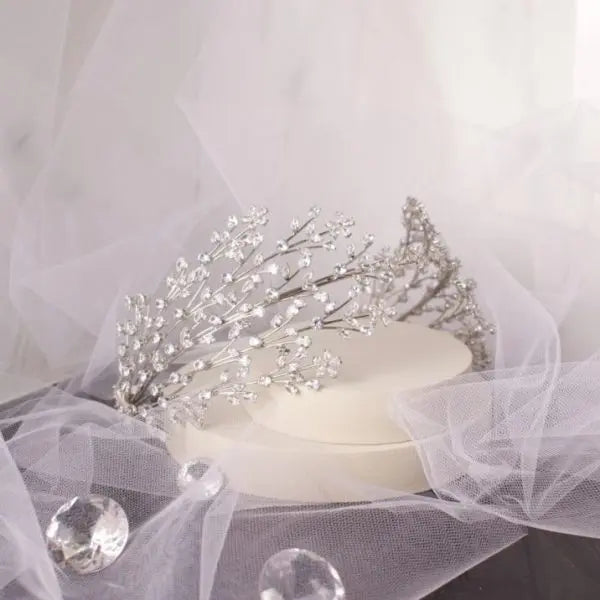 Stunning Larisa Bridal Headband, lavishly adorned with sparkling CZ crystals in a classic silver setting, designed to add radiant elegance to any bridal hairstyle.