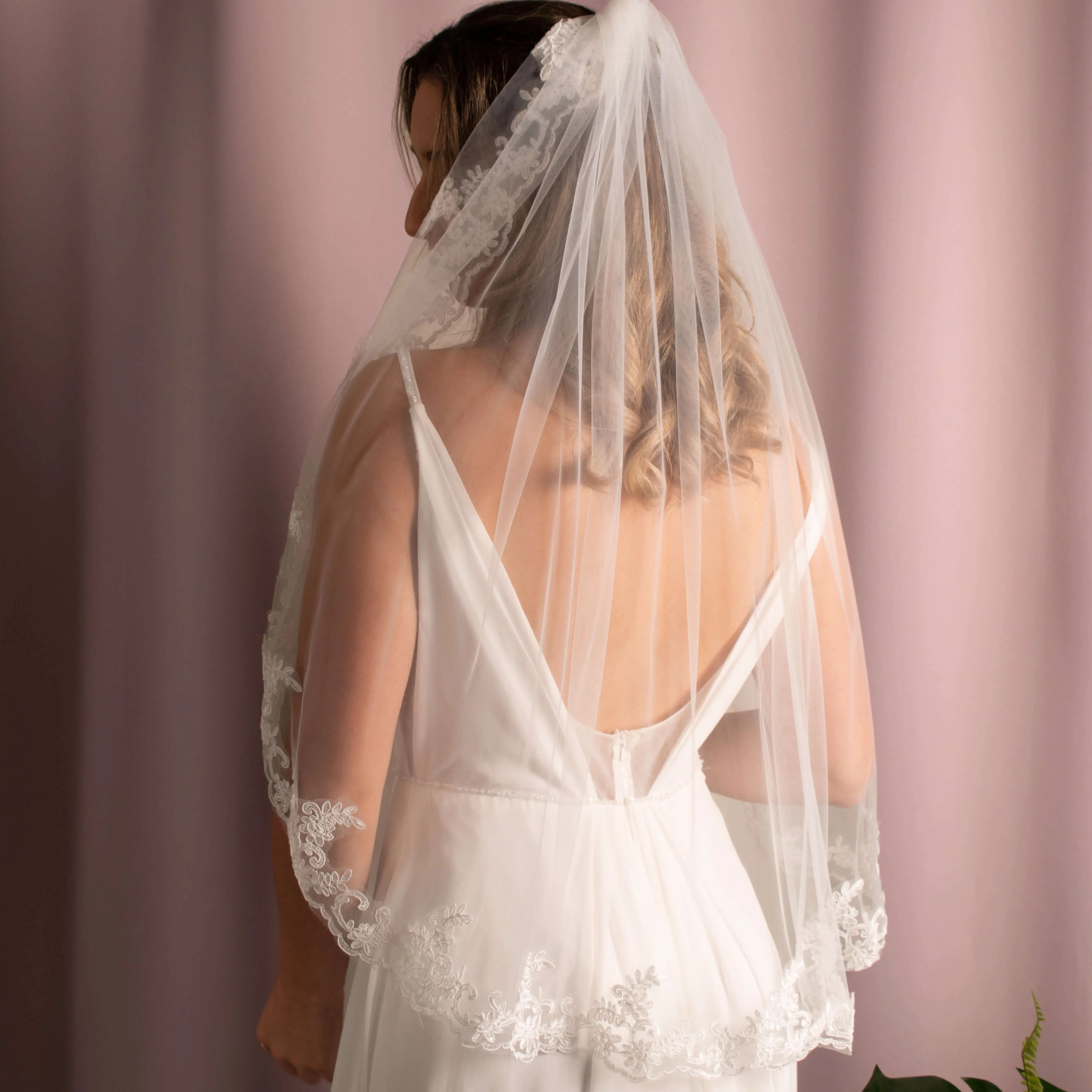 Elegant Layla Corded Lace Veil featuring soft tulle and delicate corded lace detailing, creating a sophisticated bridal look.