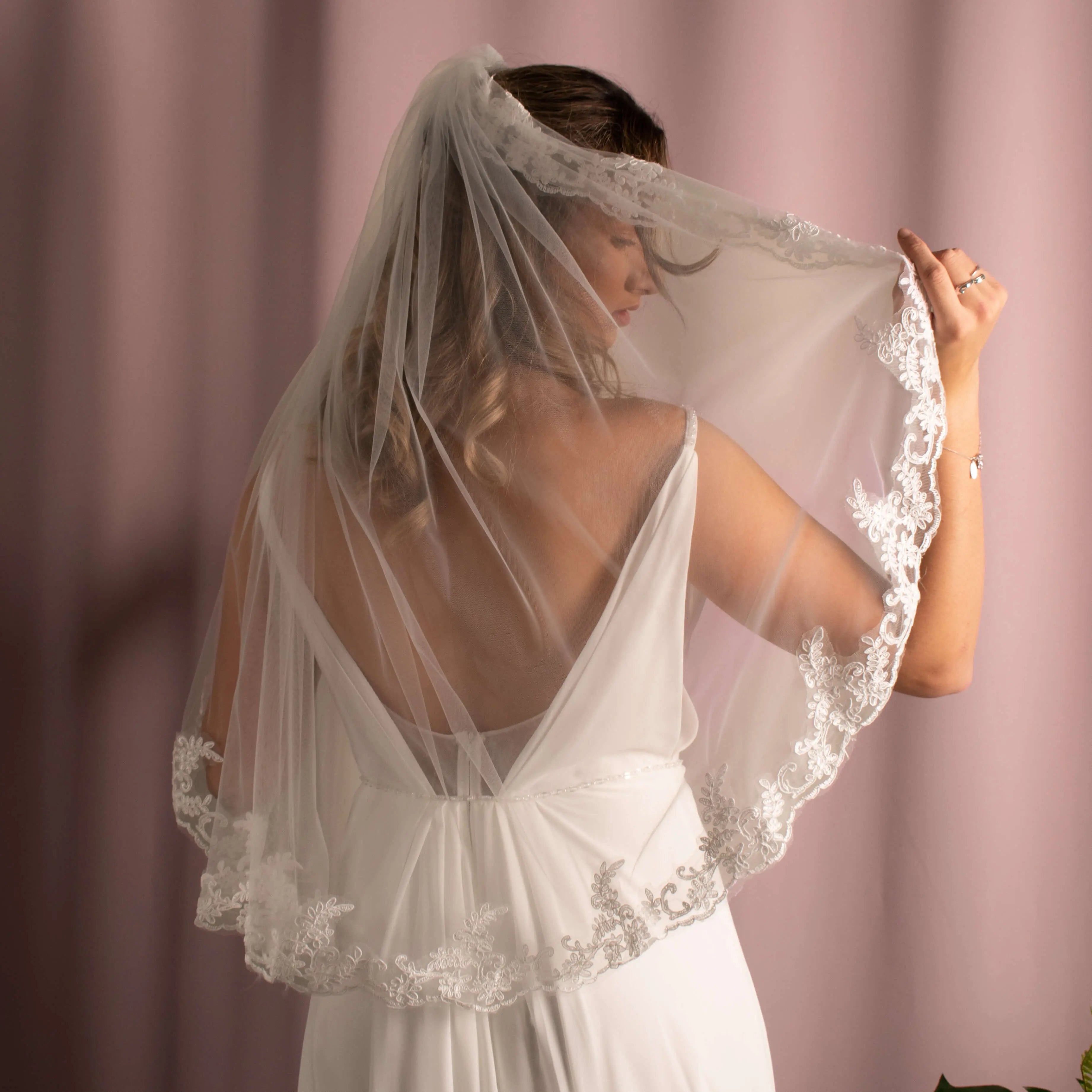 Elegant Layla Corded Lace Veil featuring soft tulle and delicate corded lace detailing, creating a sophisticated bridal look.