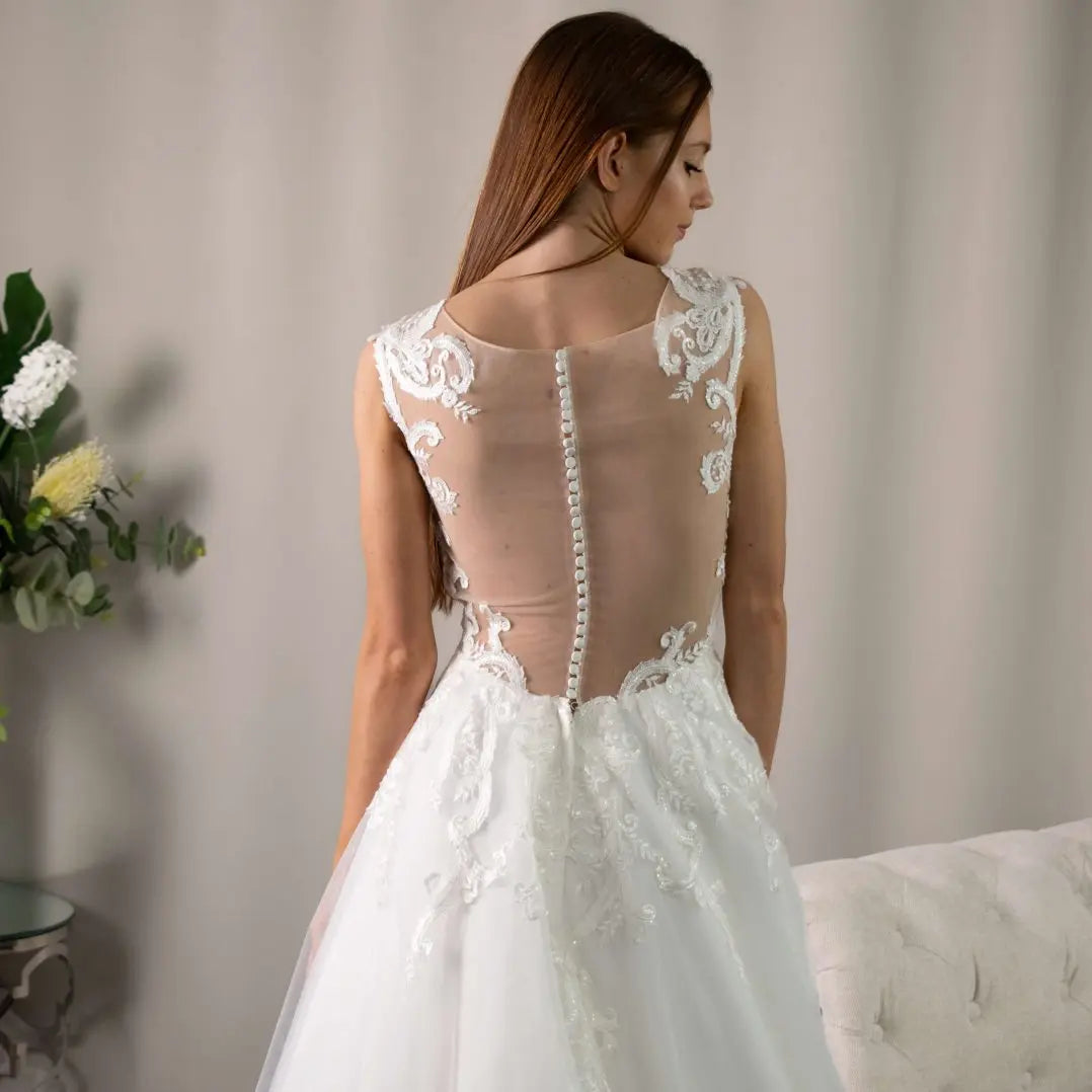 Lucia V-neckline Lace Appliqué Wedding Gown by Divine Bridal.