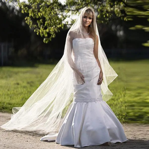 Bride wearing 'Melody' Lace Mermaid Gown with Elegant Buttoned Back