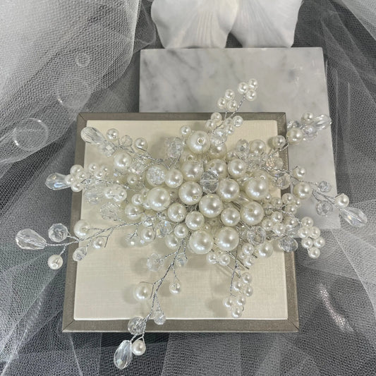 Elegant Mila Bridal Hair Comb adorned with crystals and pearls, perfect for adding a sophisticated sparkle to any bridal hairstyle.