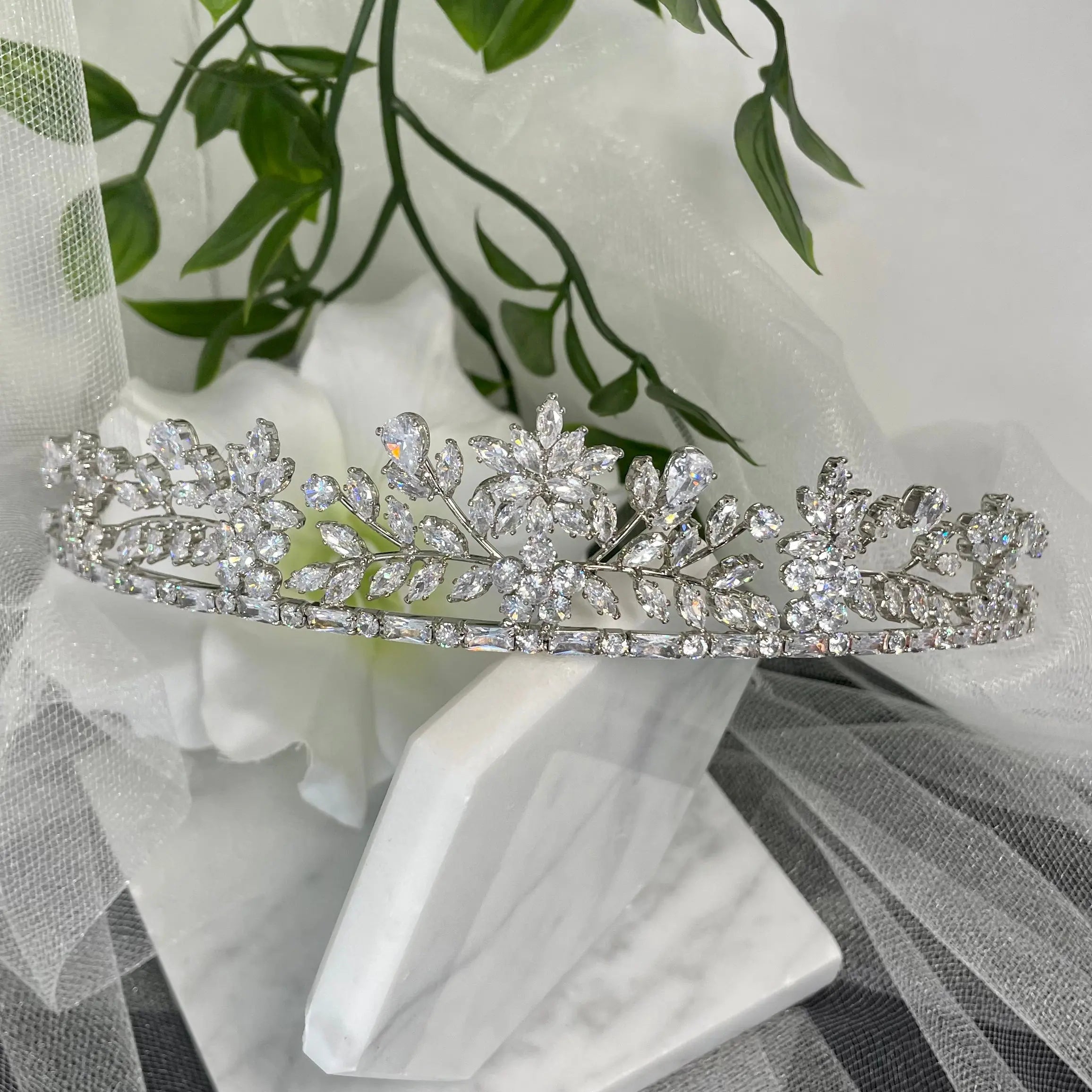 Nia Rhinestone Crystal Bridal Wedding Tiara in Silver, featuring an elegant design of diamanté crystals in floral and leaf patterns, perfect for enhancing a modern bride's look.