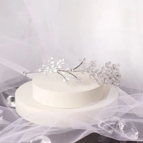 Elegant Nya CZ Leaf Bridal Tiara, adorned with sparkling solitaire stones and a crystal vine leaf design in silver, perfect for enhancing bridal elegance.