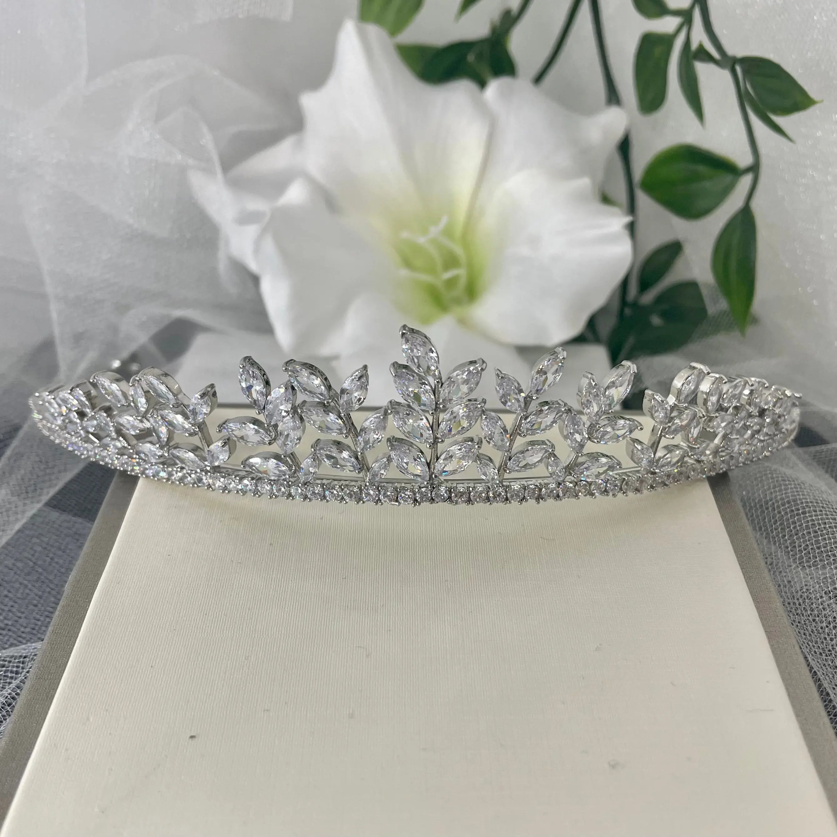 Ollie Bridal Wedding Tiara Headpiece in Silver, featuring an elegant leaf design with sparkling diamantés, ideal for enhancing a bridal look with sophistication and regal charm.