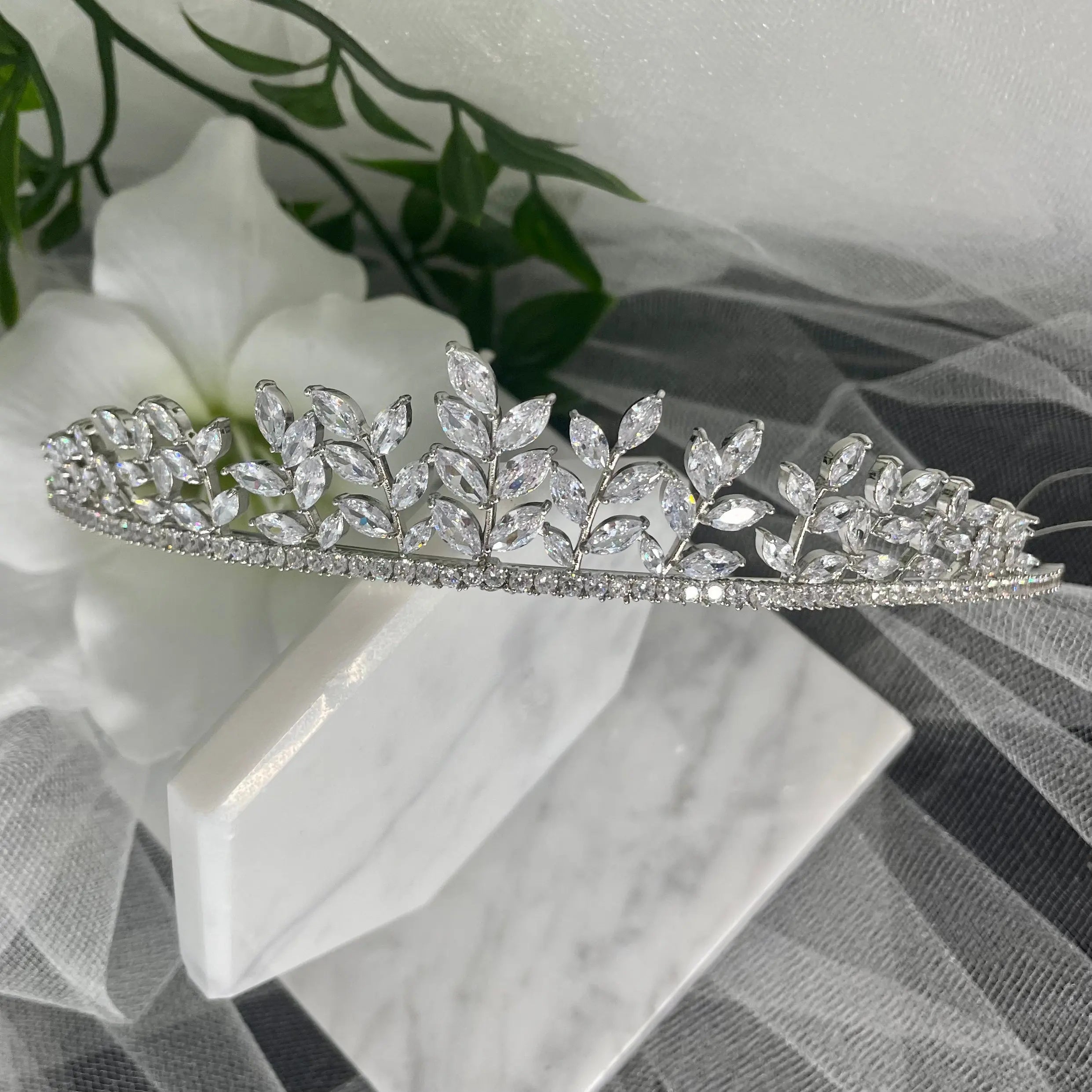 Ollie Bridal Wedding Tiara Headpiece in Silver, featuring an elegant leaf design with sparkling diamantés, ideal for enhancing a bridal look with sophistication and regal charm.