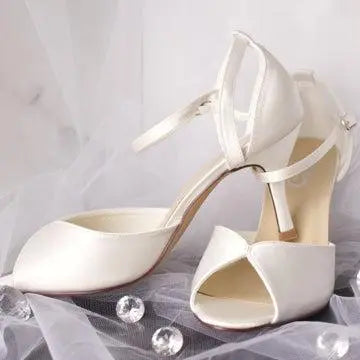 Remi satin bridal shoe with elegant crossover ankle strap.