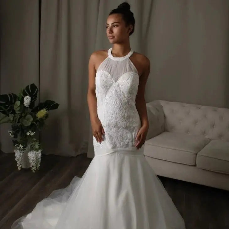 Remy – Halter-neck Sequin Mermaid Bridal Dress by Divine Bridal, showcasing a sparkling bodice and elegant train.