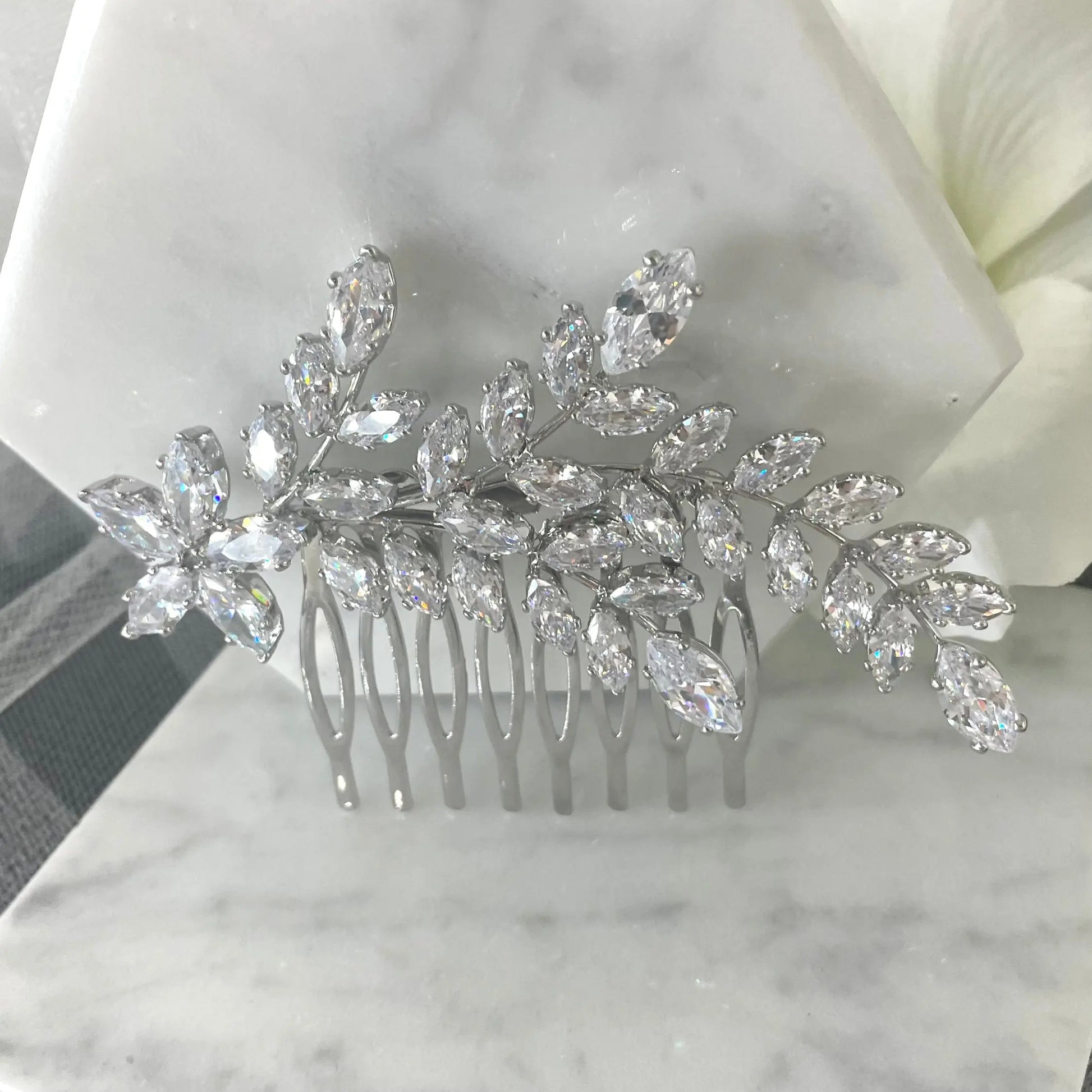 Sophisticated Ross Leaf Bridal Hair Comb in silver, adorned with sparkling marquise crystals, perfect for adding a contemporary and elegant touch to bridal hairstyles.