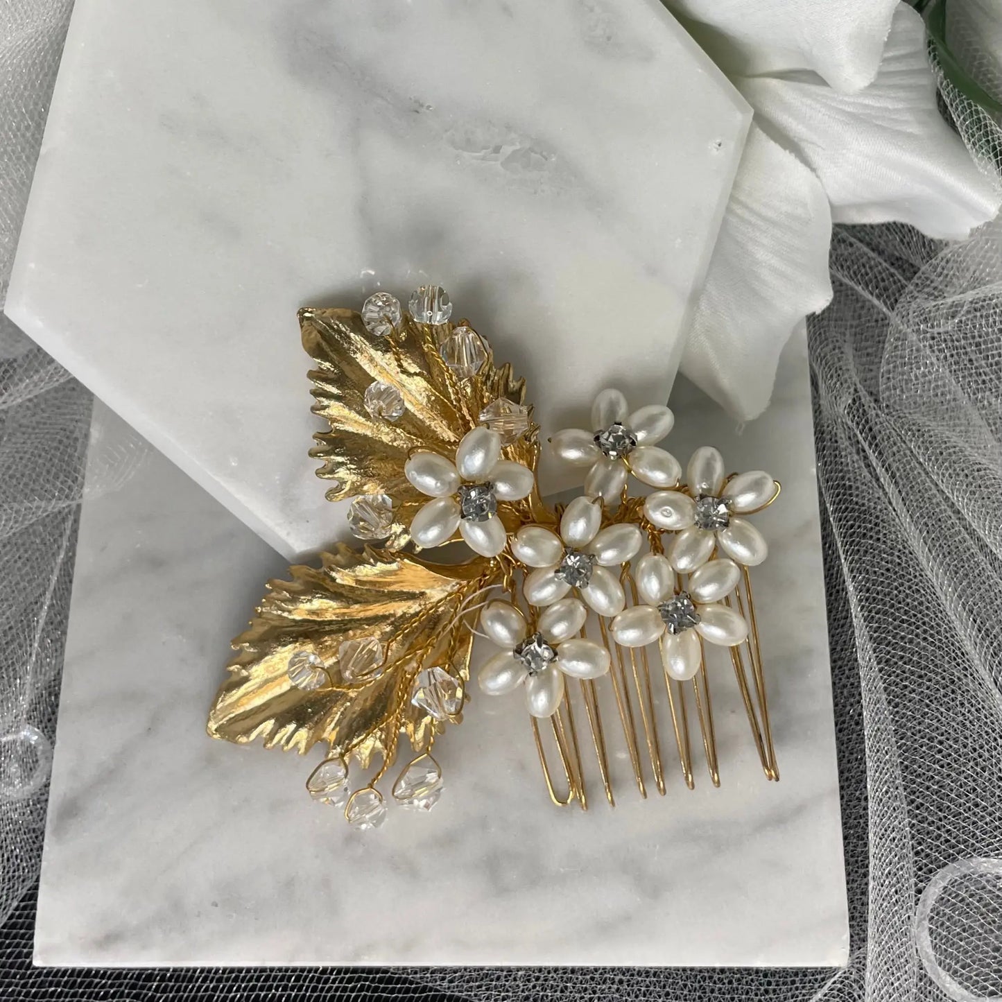 Exquisite Salina Crystal and Pearl Hair Comb featuring pearl flowers with Diamanté centers and gold leaves, perfect for adding a luxurious touch to bridal hairstyles.