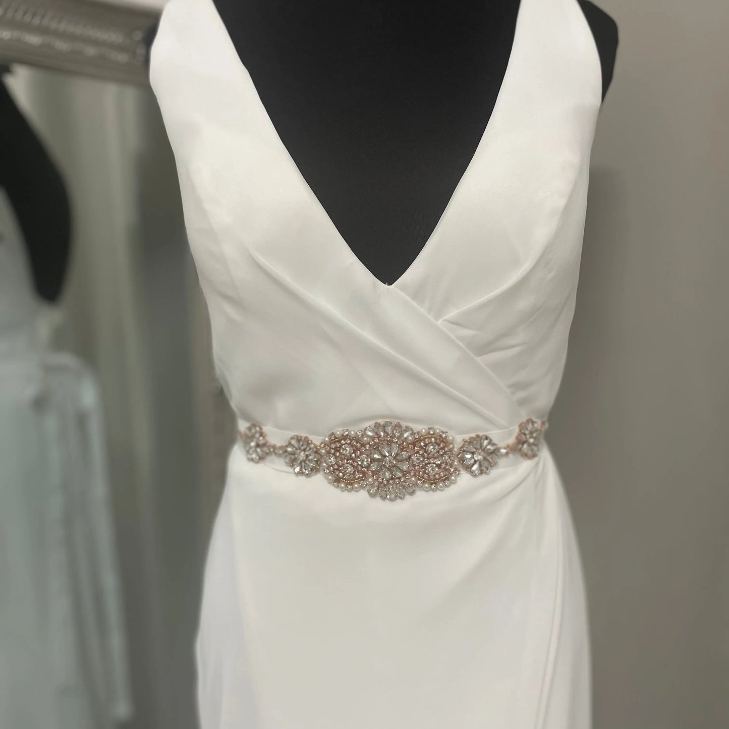 Front view of the Béa Brival Bridal Belt on a mannequin, showcasing its elegant design with pearls and Diamontes, an exquisite accessory for any bride.