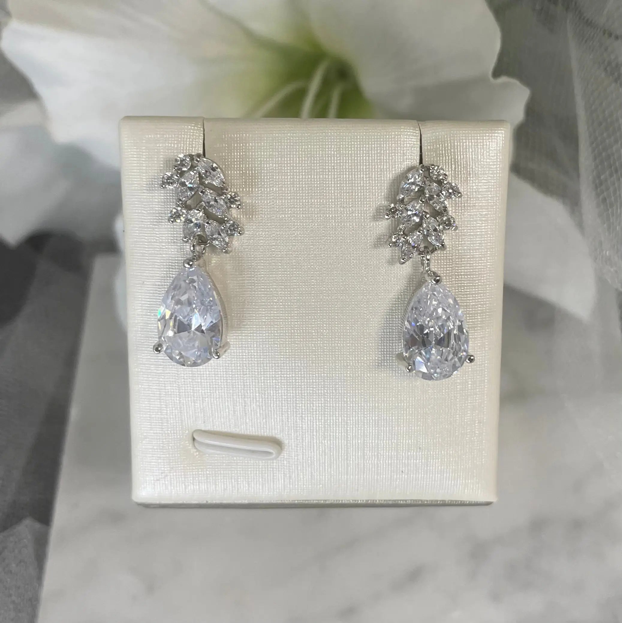 Tess Drop Bridal Wedding Earrings (Silver): Elegant silver bridal earrings featuring a clear crystal drop and leaf cluster, perfect for weddings and special occasions.