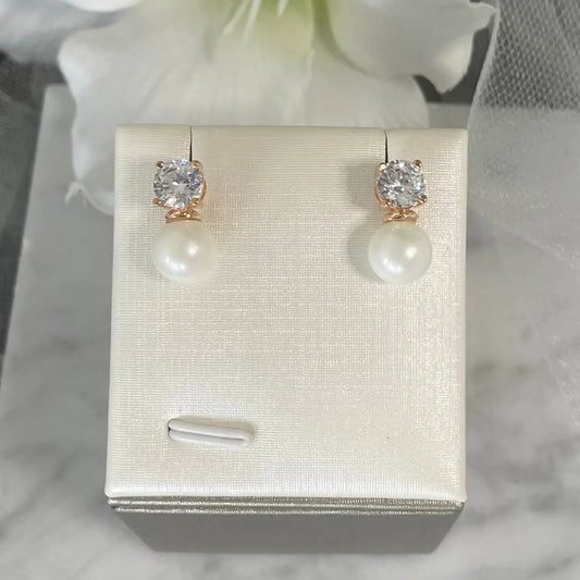 Zara Pearl & Diamond Earrings (Rose Gold): Elegant rose gold earrings featuring a pearl drop and AAA zircon stones, perfect for bridal and special occasions.