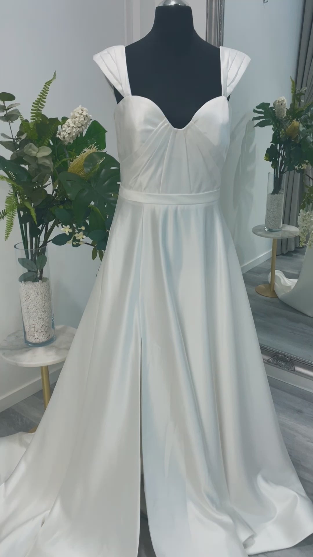 An elegant wedding dress from Divine Bridal A-Line Sweetheart gown, featuring exquisite detailing and a flowing chapel train.