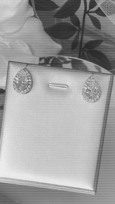 Lizzie Crystal Stud Earrings featuring a mix of pear and baguette crystals in a sophisticated silver and rose gold finish, ideal for adding elegance to any outfit.